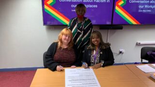 UNISON members alongside a representative from East Midlands Probation Service sign the new charter.
